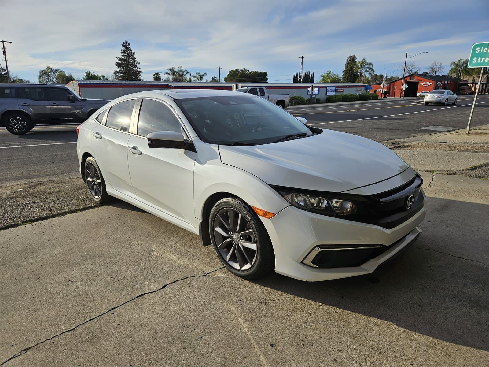 Detailed white Honda Civic with a clean reflective finish