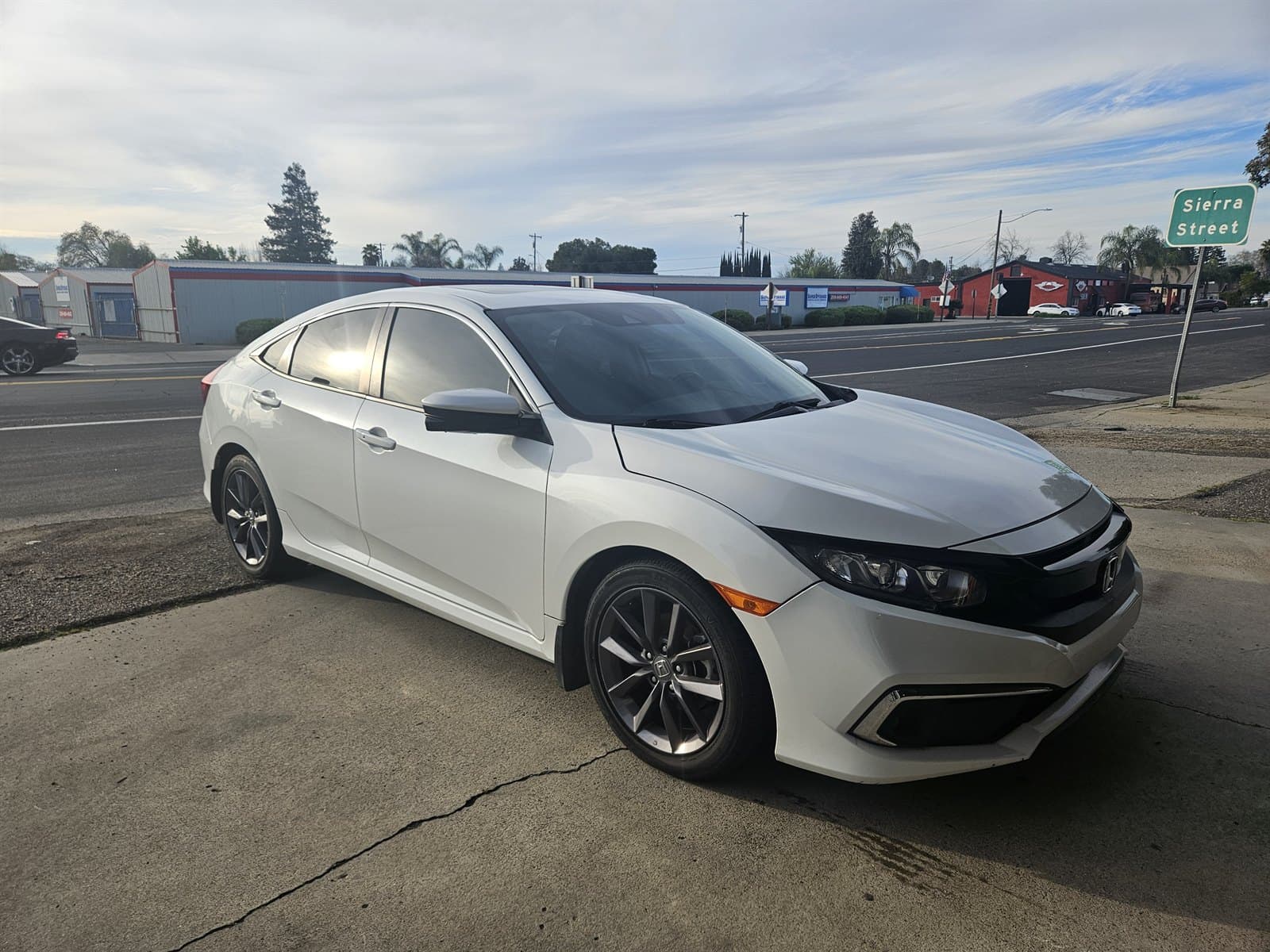 White Honda Civic with a clean finish after professional detailing